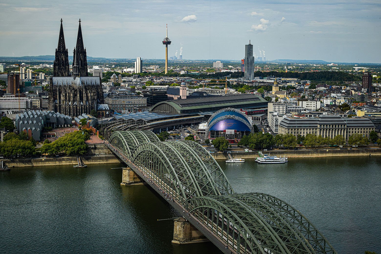 cologne-riverview Photo by <a href="https://unsplash.com/@robhall02?utm_content=creditCopyText&utm_medium=referral&utm_source=unsplash">Rob Hall</a> on <a href="https://unsplash.com/photos/an-aerial-view-of-a-city-and-a-bridge-oA84977yNx0?utm_content=creditCopyText&utm_medium=referral&utm_source=unsplash">Unsplash</a>